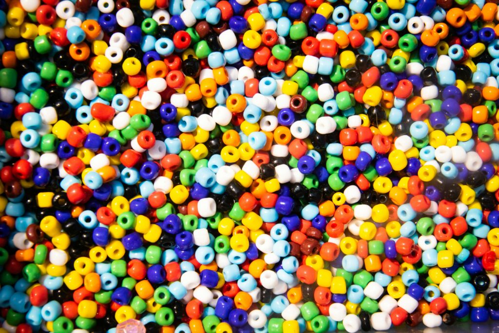 pexels photo 1331705 1331705 Vibrant collection of multicolored craft beads for creative projects and artistic designs.