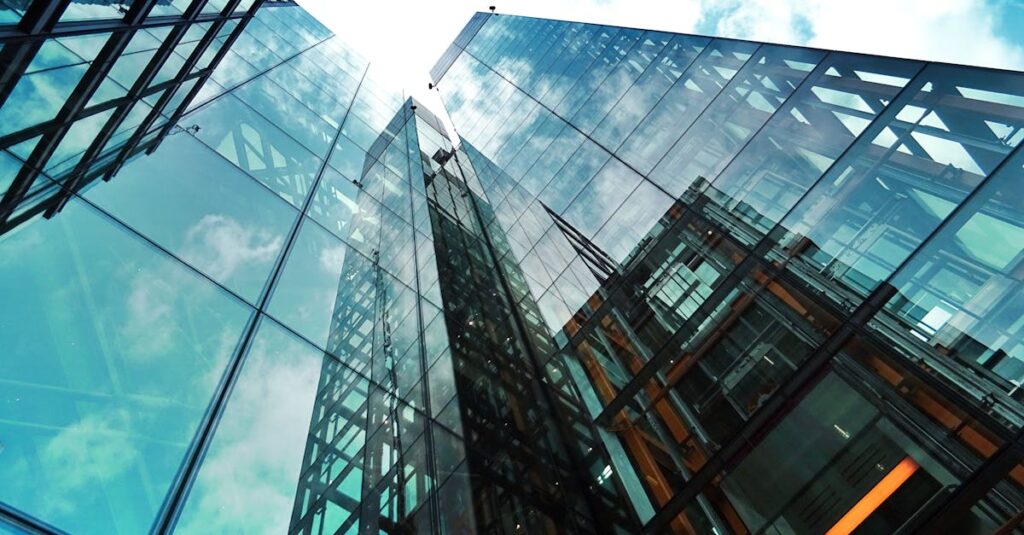 pexels photo 443383 443383 A striking view of a modern glass skyscraper reflecting the sky and clouds.